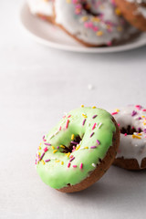 White and green Sprinkled delicious doughnuts.