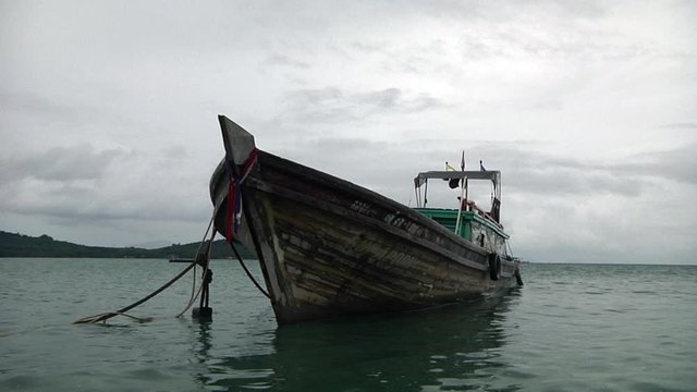 Old Wooden Boat anchored down in Phuket