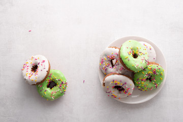 White and green Sprinkled delicious doughnuts.