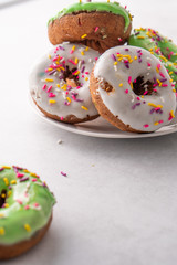 White and green Sprinkled delicious doughnuts.