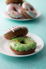White and green Sprinkled delicious doughnuts.