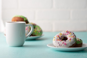 White and green Sprinkled delicious doughnuts.