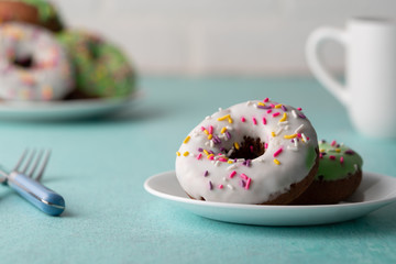 White and green Sprinkled delicious doughnuts.