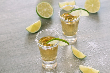 Tequila shots with sliced lime