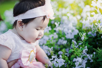 Close up portrait Asian cute baby girl with Natural light background