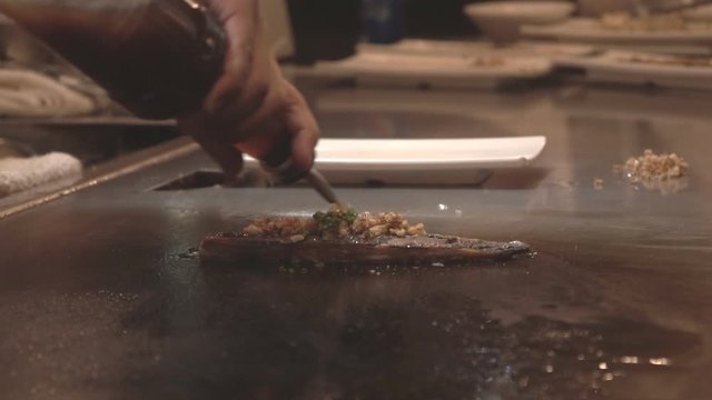 Chef Cooking Japanese Teppanyaki For Customer.  