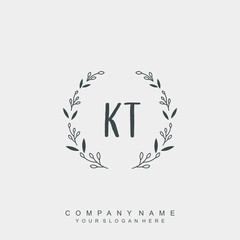 letter KT surrounded by beautiful and elegant flowers and leaves. Wedding monogram logo template.