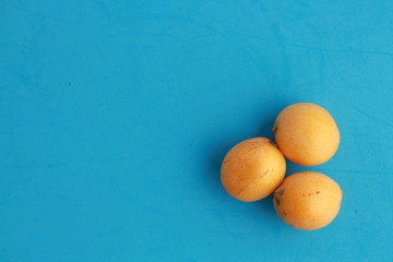 delicious yellow medlar fruit with colorful background
