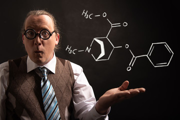 Professor presenting handdrawn chemical formula of cocaine