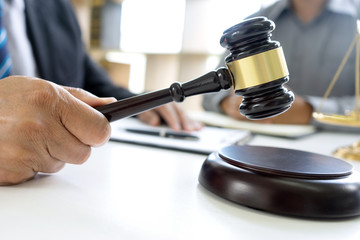 Judge or lawyer talking  with team or client