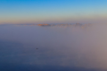Obraz na płótnie Canvas View on the Dnieper river in fog in the morning at autumn