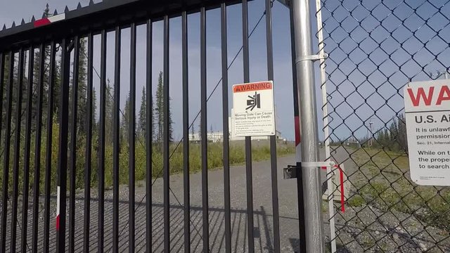Close up of warning signs and high security fence at HAARP Research Base in Alaska