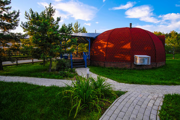 Moscow region, Russia - August, 22, 2019: The image of a tent-shaped cottage in Mosocw region, Russia