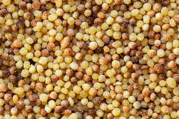 Fregola sarda closeup background -  ball shaped durum wheat toasted pasta typical of Sardinia region of Italy