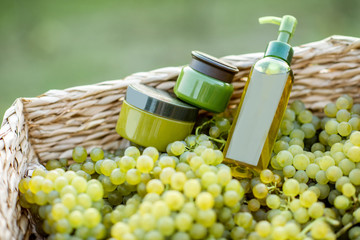Jars and bottles with cosmetics or various health products made on the basis of grapes, packaging...