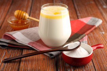 Hot milk with butter, honey and sodium bicarbonate, a folk remedy for a strong cough, with a bronchial disease.