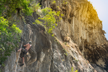 mnn climbing on the wall