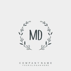 letter MD surrounded by beautiful and elegant flowers and leaves. Wedding monogram logo template.