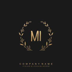 letter MI surrounded by beautiful and elegant flowers and leaves. Wedding monogram logo template.
