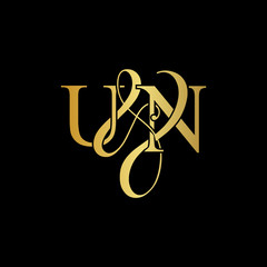 Initial letter U & N UN luxury art vector mark logo, gold color on black background. © ZafieraStudio