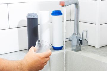 Replacing the water filter. Ecology. Clean water.