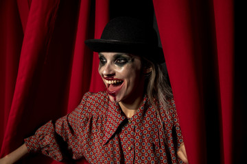 Side view of halloween make-up woman laughing