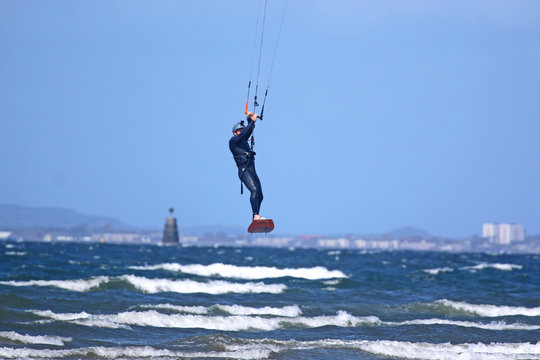 Kitesurfer riding off Barassie Beach, Troon