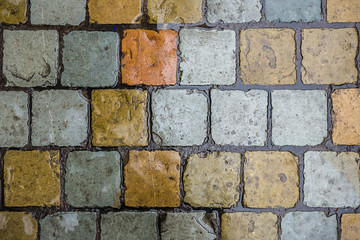 Wet from the rain colorful brick tiles horizontal background texture.