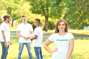 Portrait of young female volunteer outdoors