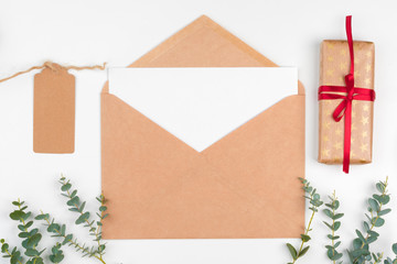 Top view of empty letter on wooden table with christmas decoration