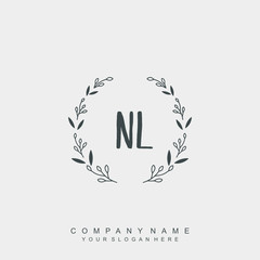 letter NL surrounded by beautiful and elegant flowers and leaves. Wedding monogram logo template.