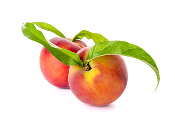 Ripe peaches on white background