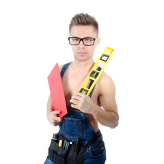 Young attractive handyman with tools.