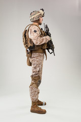 Rear view of military soldier US army marines operator studio shot portrait