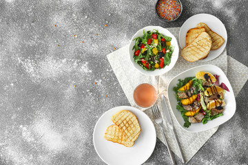 Composition with tasty salads on table