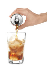 Woman pouring cola into glass on white background