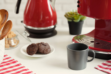Cup of tea or coffee on modern kitchen background