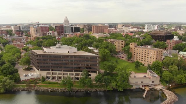 4k aerial footage panning left to right of Madsion Wisconsin capital building and surrounding buildings in downtown