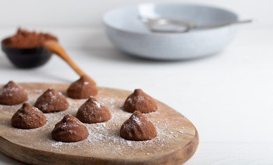 chocolate truffles on a wooden plate