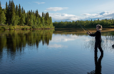Fototapeta na wymiar Woman fishing