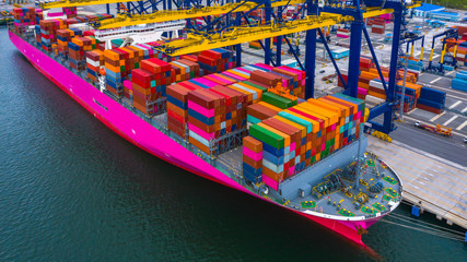 Container ship loading and unloading in deep sea port, Aerial view of business logistic import and  export freight shipping transportation by container ship in open sea.