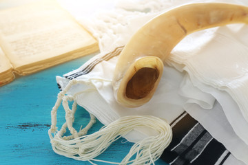 religion image of Prayer Shawl - Tallit, Prayer book and Shofar (horn) jewish religious symbols. Rosh hashanah (jewish New Year holiday), Shabbat and Yom kippur concept.
