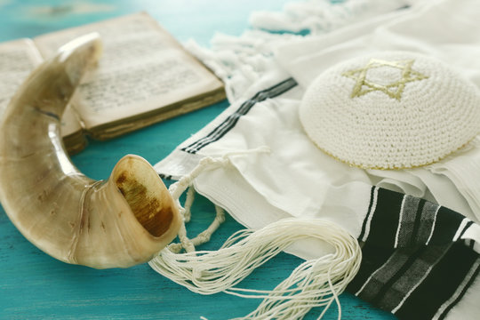 religion image of Prayer Shawl - Tallit, Prayer book and Shofar (horn) jewish religious symbols. Rosh hashanah (jewish New Year holiday), Shabbat and Yom kippur concept.