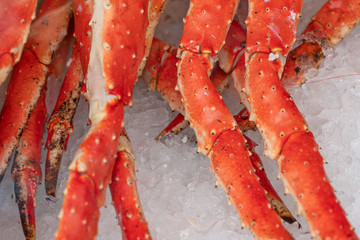 Crab legs on the ice in fish market