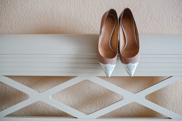 Beautiful shoes for the bride. Background texture.