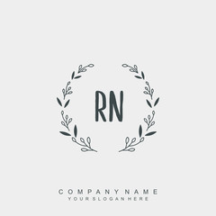 letter RN surrounded by beautiful and elegant flowers and leaves. Wedding monogram logo template.