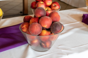 glass bowl filled with peaches