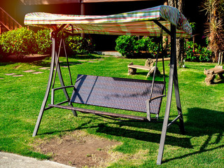 Outdoor garden rattan swing seat bench.