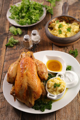 baked chicken with mashed potato and sauce