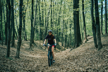 Fototapeta premium Women is riding on bicycle.